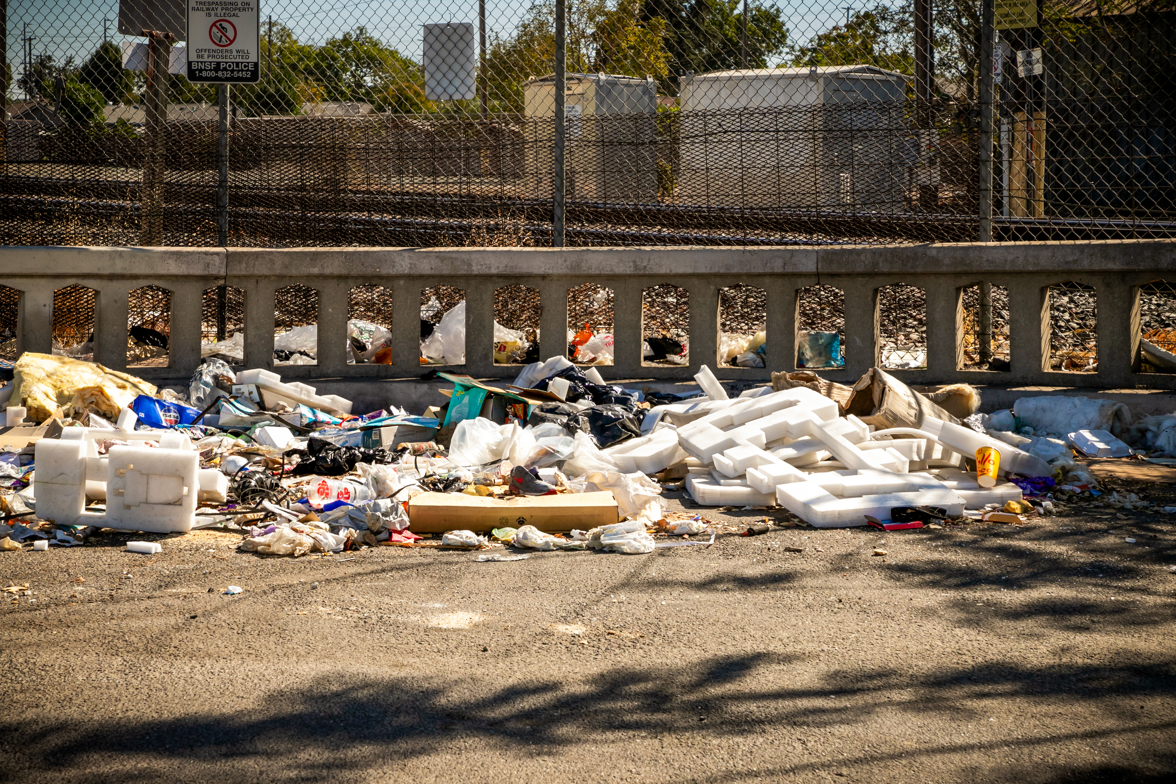 An Illegal dump site littered with discarded refuse